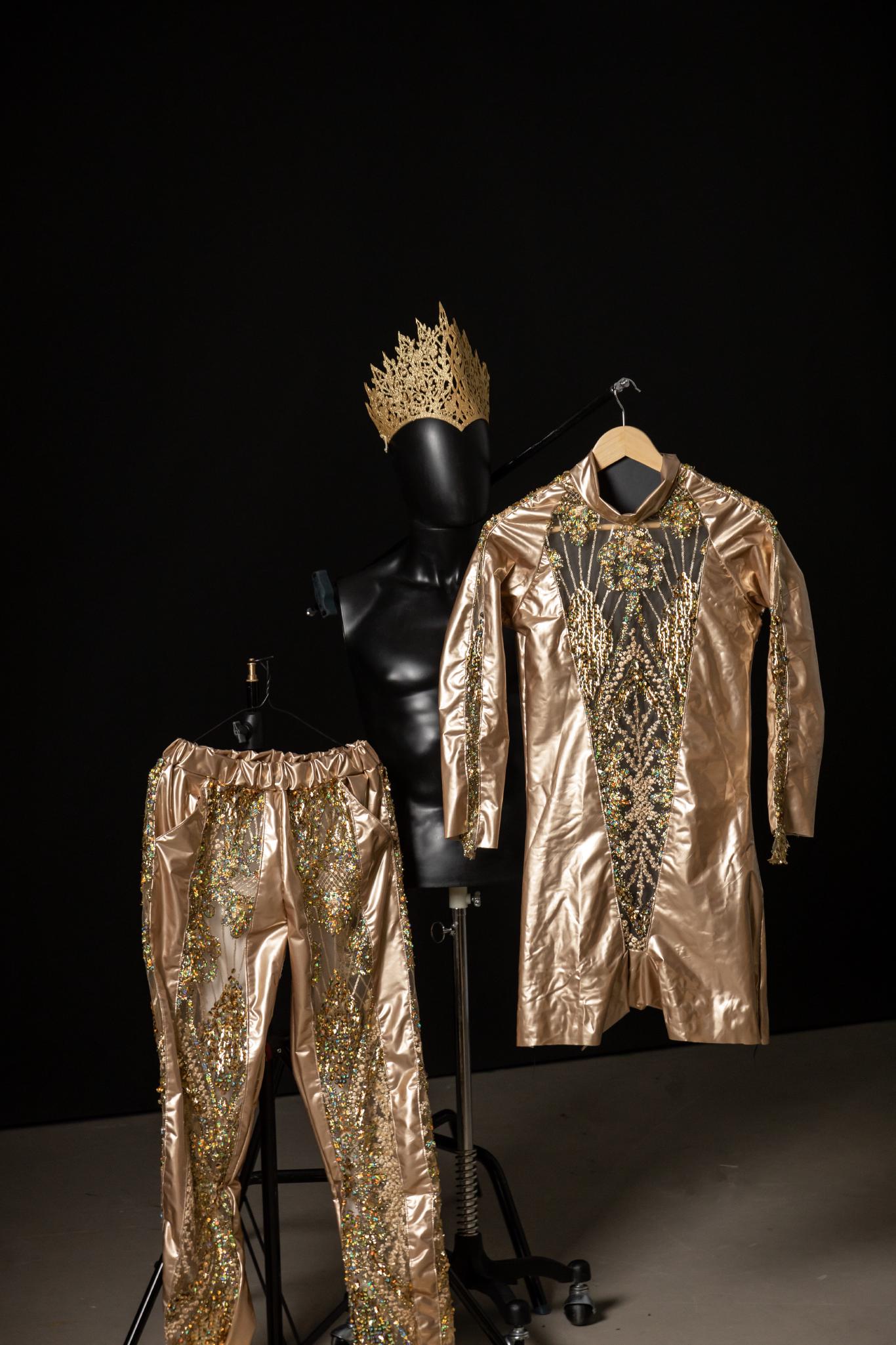 A gold and glittery full body suit.